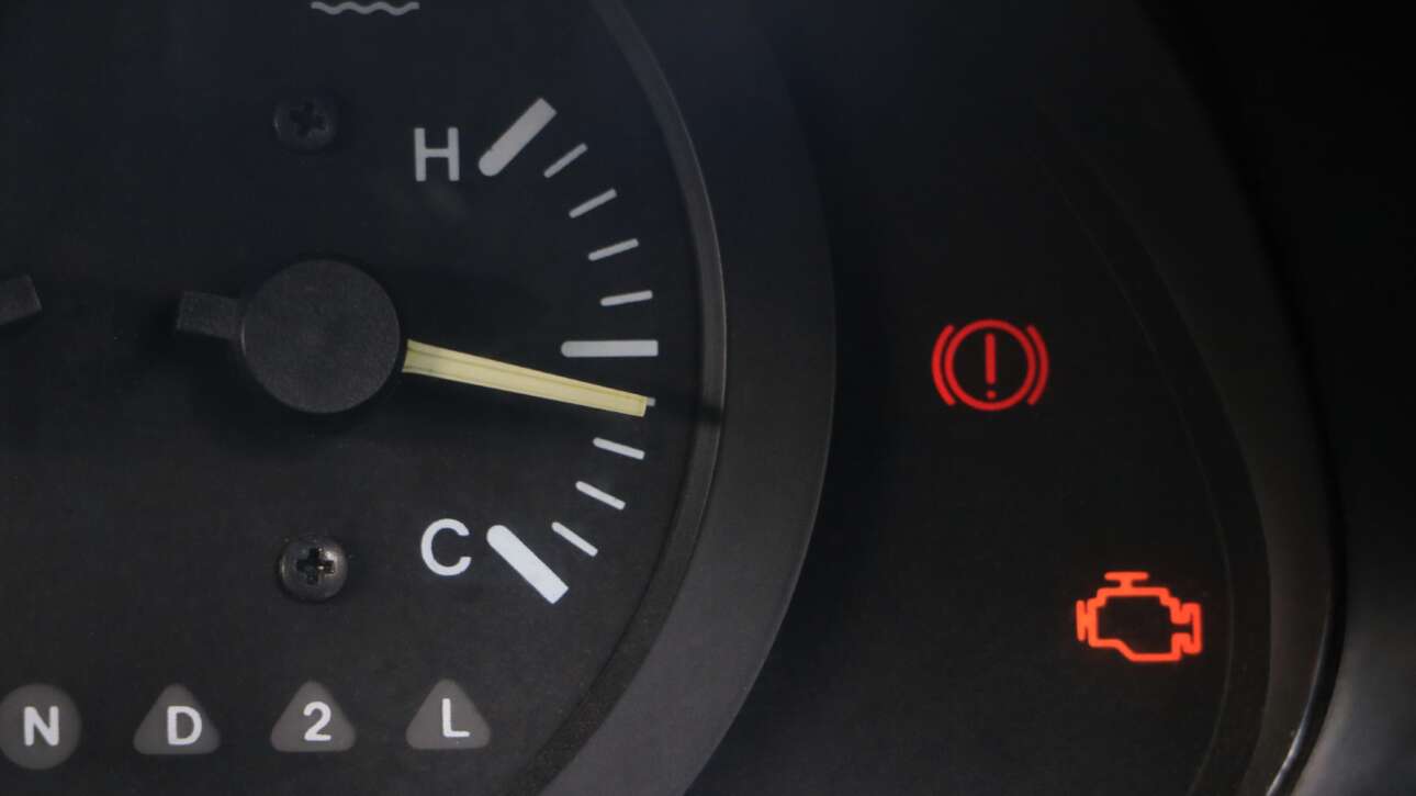Check Engine Light Illuminated On A Car Dashboard, An Automatic Nj Car Inspection Failure